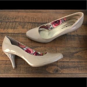Nude patent pumps